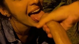 Hot brunette sucks friend's dick outside car in public after party