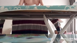 ironing my laundry but seen from the front