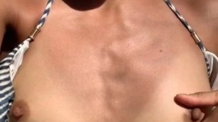 Fit asian flashes her bikini and masturbates outside
